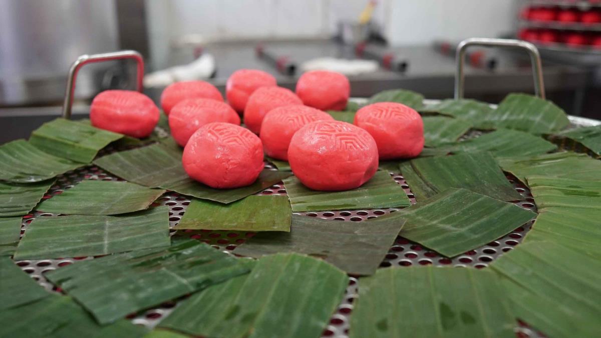 Hand-rolled ang ku kueh, ready for steaming